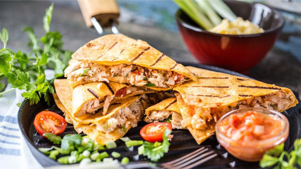 The Chicken Quesadilla · Tender, grilled chicken, and loads of our melty cheese blend folded in a large, soft flour tortilla and grilled until brown and crispy.
