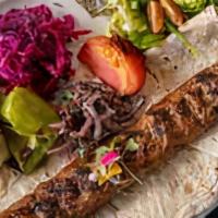 Adana Kebab · Mixed ground new Zealand lamb, beef, bell peppers, olive oil, and garlic. Served with rice p...