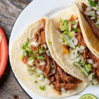 Just a Taco on a Plate · 2 tacos with choice of meat, onions, cilantro, hot salsa, served with choice of beans & rice...