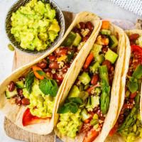 The Veggie Taco Game · Rice, beans, onions, cilantro, hot salsa, cheese, sour cream, avocado, lettuce. Served with ...