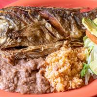 35. Fried Fish/Pescado Frito · Fried Tilapia Fish. Served with rice, beans, salad and corn tortillas