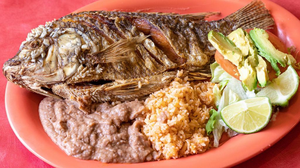 35. Fried Fish/Pescado Frito · Fried Tilapia Fish. Served with rice, beans, salad and corn tortillas