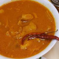 Menudo · Traditional Mexican soup, made with cow's stomach (tripe) in broth with a red chili pepper b...