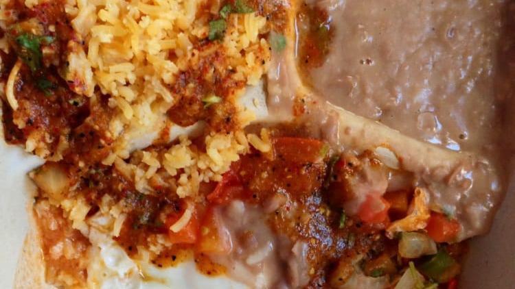 Huevos Rancheros · Two eggs sunny side up, rice, beans and mild salsa.