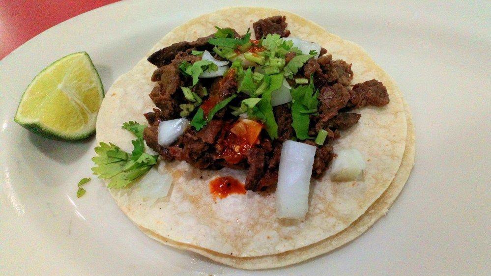 Regular Taco · Meat, onions, cilantro and salsa.