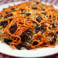 Quabili Pallow · Pallow (afghan style basmati rice) baked with chunks of beef with raisins and glazed julienn...