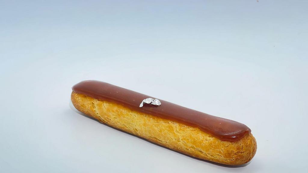 CHOCOLATE ECLAIR · Classic French eclair made with a pate à choux filled with a 70% dark chocolate cremeux and glaze with a chocolate glaze