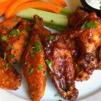 8 Chicken Wings · Your choice of bbq or buffalo sauce, with celery, carrots, and ranch dressing