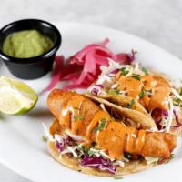 Baja Tacos · Two tacos with beer battered fish, cabbage slaw, pickled onion, chipotle aioli, house salsa ...