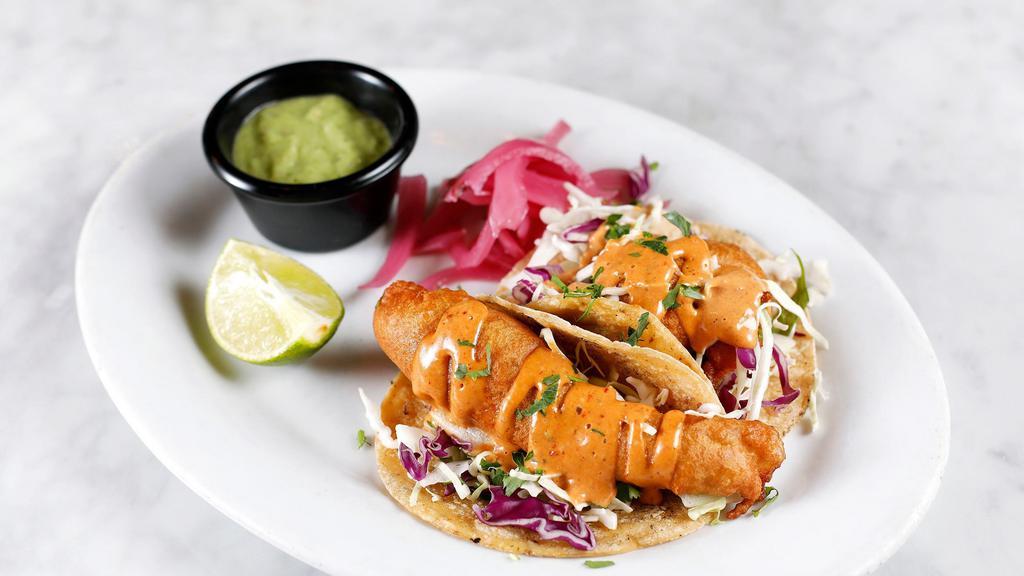 Baja Tacos · Two tacos with beer battered fish, cabbage slaw, pickled onion, chipotle aioli, house salsa & pico de gallo