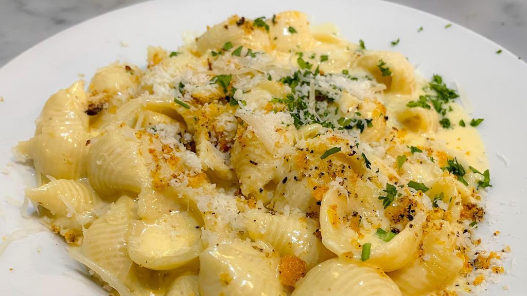 Mac n Cheese · Three cheese béchamel with bread crumbs