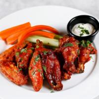 4 Chicken Wings · Your choice of bbq or buffalo, with celery, carrots, and ranch dressing