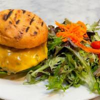 Classic Burger · Schmitz ranch beef patty w/ lettuce, tomato, onions, cheddar & garlic aioli on a toasted bun