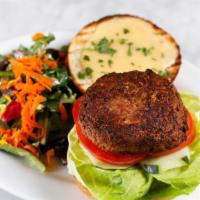 Beyond Burger · Vegan, beyond meat burger served with lettuce, tomato, pickles, and peach coulis. On vegan b...