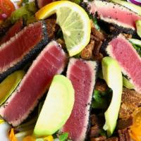 Seared Tuna Salad · Poppyseed crusted yellowfin tuna, mixed greens, red onion, cherry tomatoes, bacon, avocado, ...