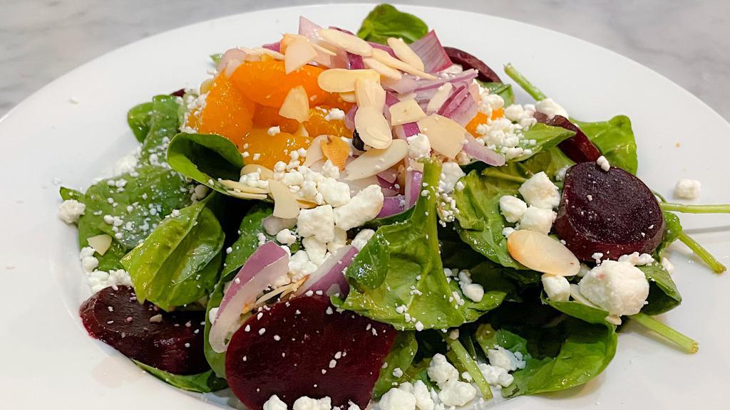 Fresh Beet & Spinach Salad · red & golden beets, red onion, goat cheese, mandarin, sliced almonds & house balsamic vinaigrette on bed of baby spinach