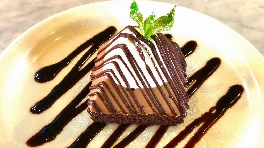 Chocolate Overload · dark & white chocolate mousse on chocolate chiffon cake base w/dark chocolate drizzle