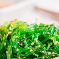 Wakame · Seaweed salad, lemon slices.
