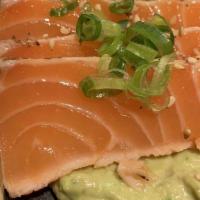 Guaca Sake · Pan-seared Norwegian salmon with garlic and pepper, served on a bed of garlic guacamole, cit...