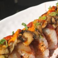 Godfather Roll · Shrimp tempura, spicy crab, spicy tuna, avocado, albacore tuna, tuna, sautéed mushrooms in g...