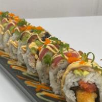 Biggie Roll · Shrimp tempura, spicy tuna, crab salad, avocado, seared tuna, grilled eel, on a bed of Korea...