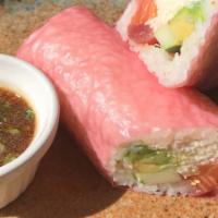 Sushi Burrito · Salmon, tuna, crab salad, avocado, cucumber, soy wrap served with our garlic yuzu ponzu sauce.