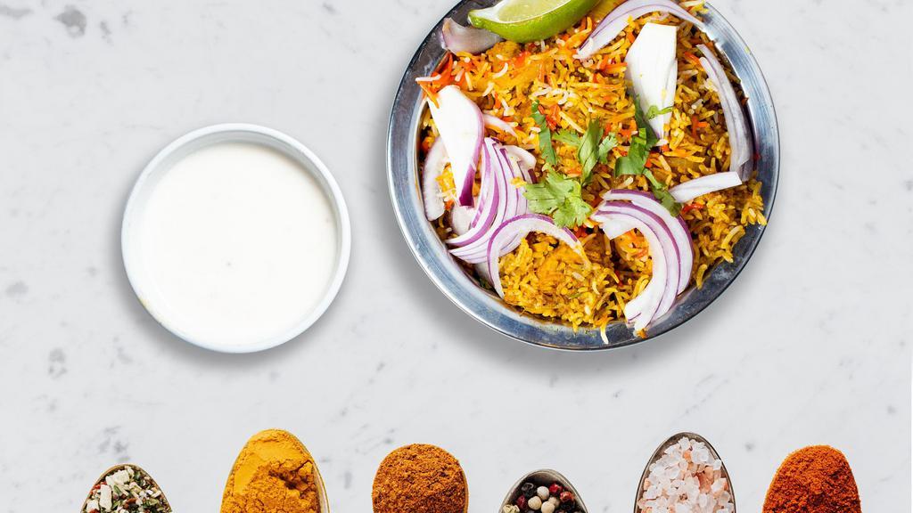 Is There Biryani-body Out There? · Spiced seasoned vegetables cooked with Indian spices and basmati rice. Served with house raita.