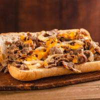 Original Philly Cheesesteak · Thinly sliced steak layered with grilled onions and cheddar cheese sauce on a French roll.