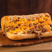 Cajun Cheesesteak · Thinly sliced steak layered with grilled onions, Cajun seasoning and cheddar cheese sauce on...