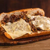 Teriyaki Cheesesteak · Thinly sliced steak layered with grilled onions, teriyaki sauce and white american cheese on...
