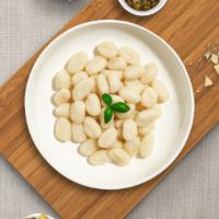 Your Own Truffle Gnocchi  · Gnocchi pasta stuffed with ricotta and parmesan cheese and fresh black summer truffles cooke...