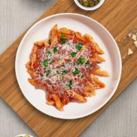 Just A Penne  · (Vegetarian) Penne pasta cooked in a spicy sauce made with minced garlic, basil, Roma tomato...