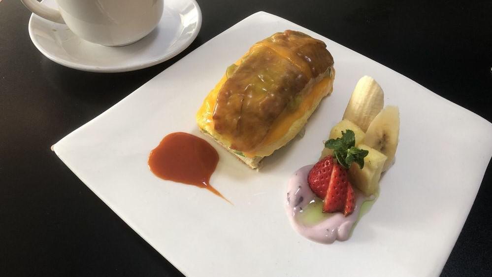 Tex Mex Omelet Sandwich · Scramble eggs, pico de gallo, bacon, avocado, melted cheddar, sweet roll and fruits.