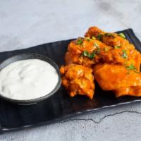 Winger Takes All · Our homemade crispy chicken wings are a crowd favorite served with blue cheese slx pleces se...