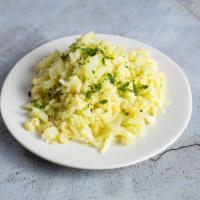 Garlic Cauliflower Rice · Minced cauliflower sauteed with garlic and butter. NUTRITION PER SERVING: Serving Size 1/2 c...