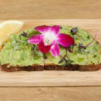 Naked Toasty · Classic avocado toast on artisan sourdough bread with salt, lemon, pepper & micro greens.