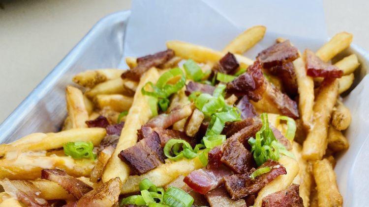 Bacon Cheese Fries · Golden fries topped with cheese, bacon, and green onions.