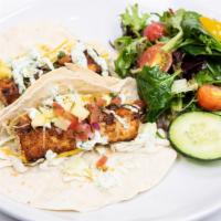Pacific Beach Fish Tacos · Blackened catch of the day with shaved cabbage, mango pico de gallo, shredded cheese, and ci...