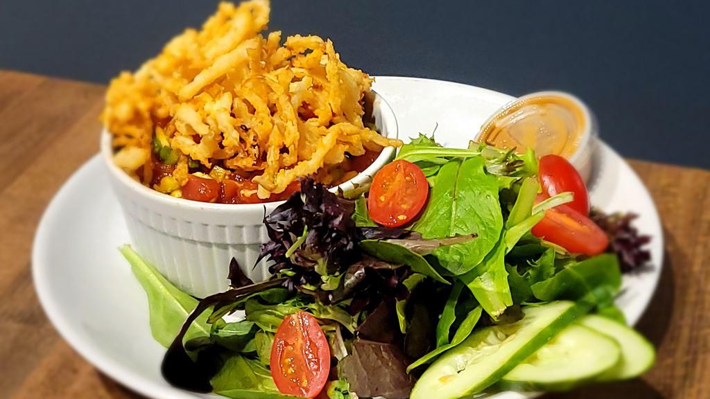Poke bowl  · Cool ahi poker over warm rice and topped with crispy onions and served with a side of salad.