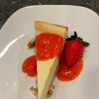 NY Cheesecake  · Creamy NY Style cheesecake smothered with fresh homemade strawberry sauce