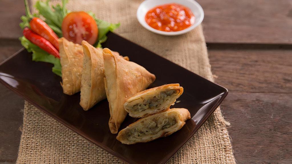 Sambusa · Fresh Herb and Potato-filled Pastry, served with Chutney