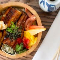 Unagi Don · Japanese rice bowl topped with cooked unagi(eel), with sides of soft boiled egg, tsukemono, ...