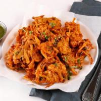 Vegetable Pakora · Mixed vegetable fritters dipped in spiced chickpea batter.