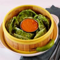 Vegetable Momo · Nepali delicacy prepared with shredded veggies and Himalayan spices filled in cover with thi...