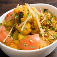 Aloo Gobi · Vegan. Fresh cauliflower and potatoes cooked with spices.