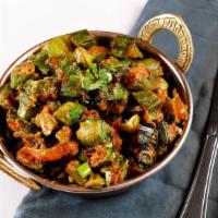 Bhindi Masala · Vegan. Fresh cut okra cooked with tomato and onion gravy.