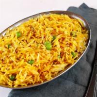 Egg Fried Rice · Cumin flavored basmati rice cooked with fried egg and peas.