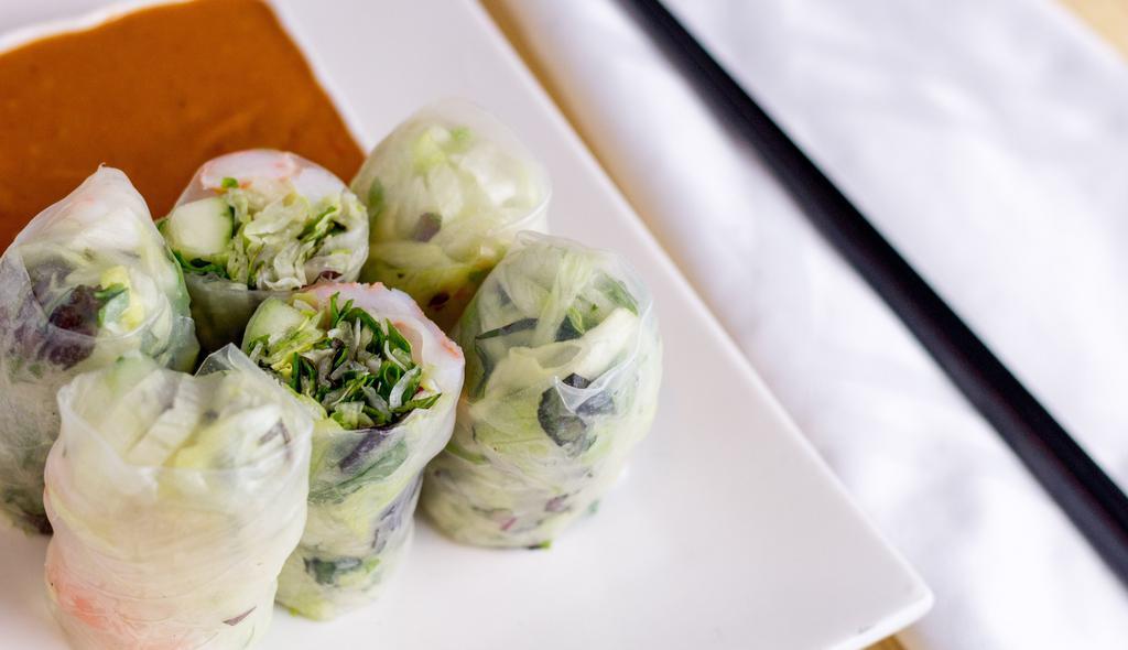 02 - Fresh Rolls · Choice of chicken or tofu, cucumber, lettuce, carrots, green onion and basil wrapped in rice paper served with peanut sauce.