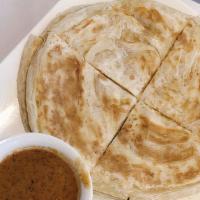 07 - Roti · Thai pancake served with house red curry dip.