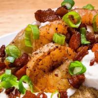 Gourmet Bacon and Shrimp Stuffed Potato  · Each Large potato is freshly made to order 
This delicious stuffed potato comes with bacon, ...